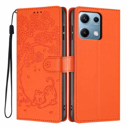 Orange flip phone case with embossed cat scene, card slot, and wrist strap