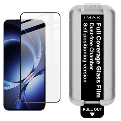 IMAK clear tempered glass screen protector on dark blue phone screen, with tray