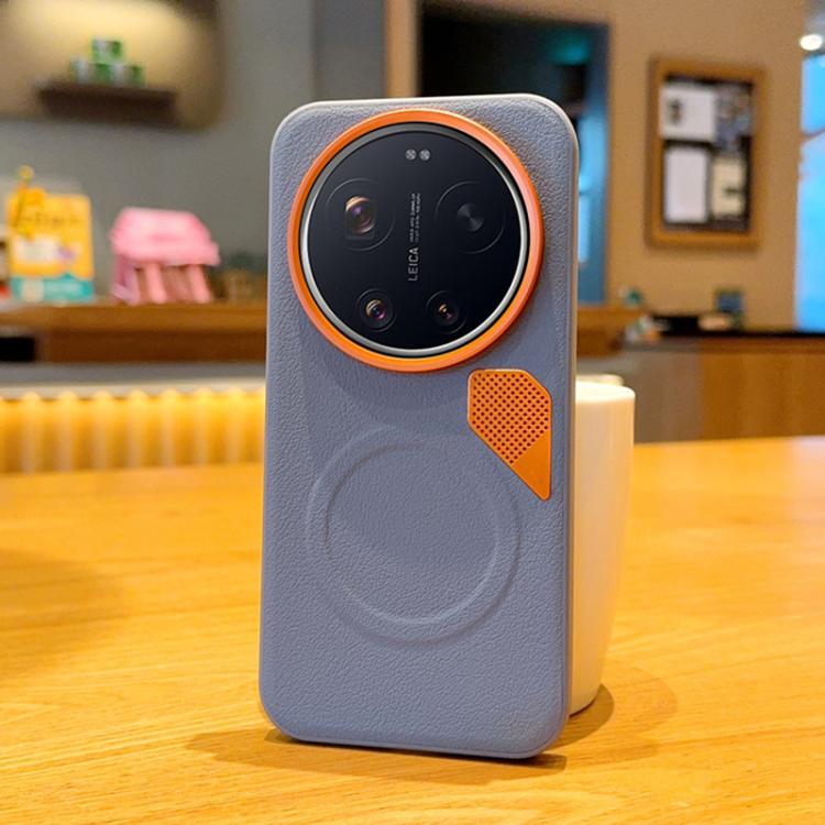 Light gray MagSafe phone case with orange camera ring and vented leather-look patch