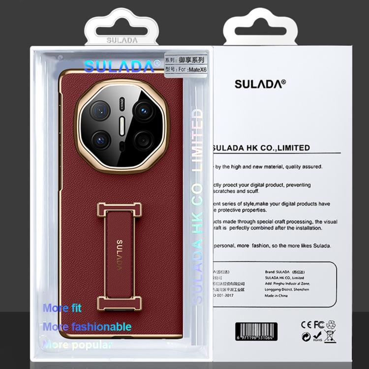 Red leather phone case with wrist strap, shown on retail packaging