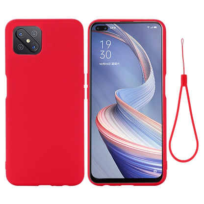 Red full-coverage liquid silicone phone case with lanyard, camera cutouts and raised edges