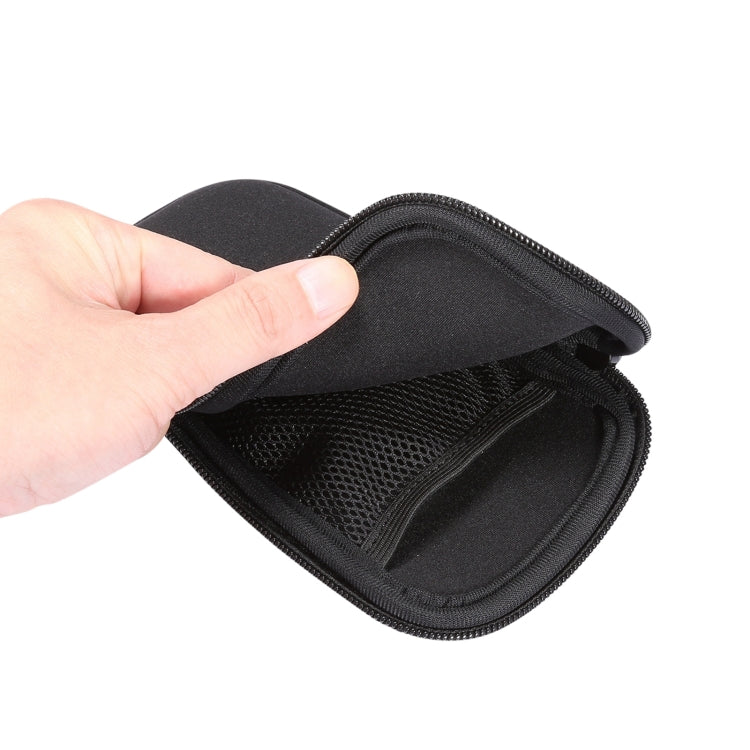 Black zip pouch opened to show mesh organizer pocket inside.