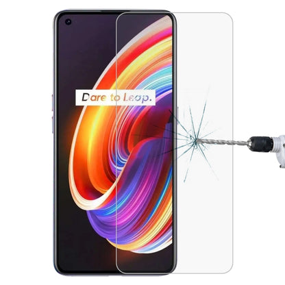 Clear tempered glass screen protector over colorful smartphone screen with impact cracks