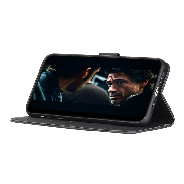Black folio phone case propped up on a flip stand
