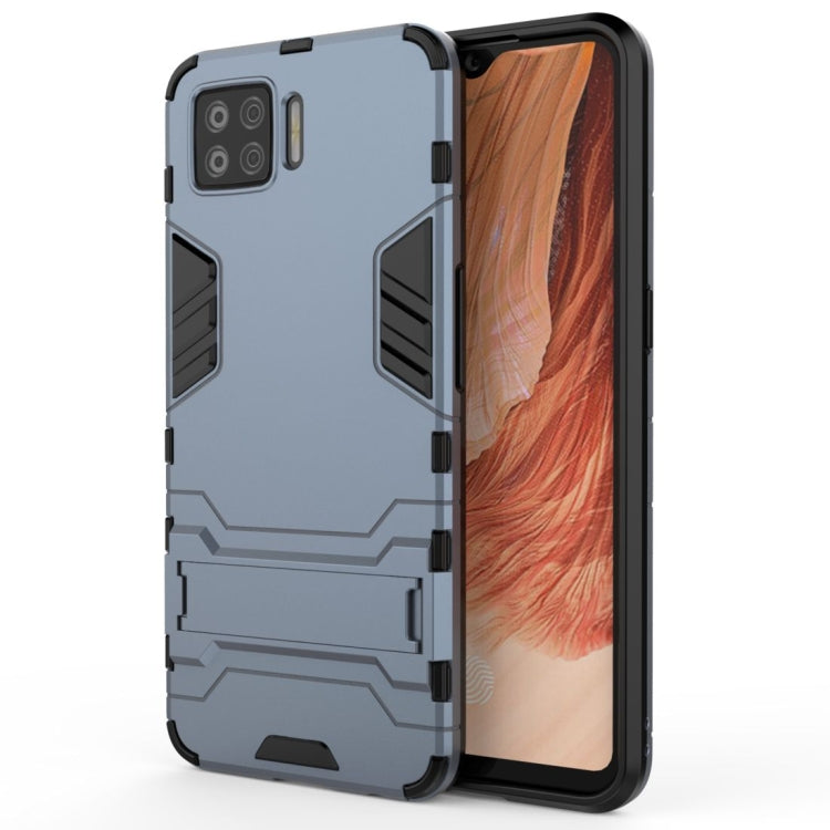 Navy blue rugged shockproof phone case with invisible holder, raised edges and camera cutouts.