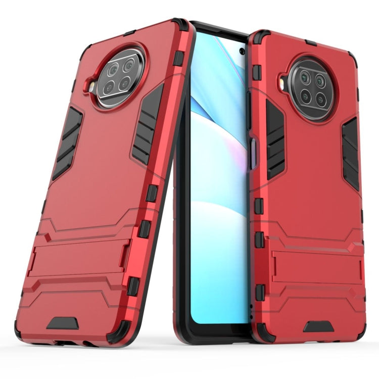 Red shockproof phone case with raised corners and triple-camera cutout