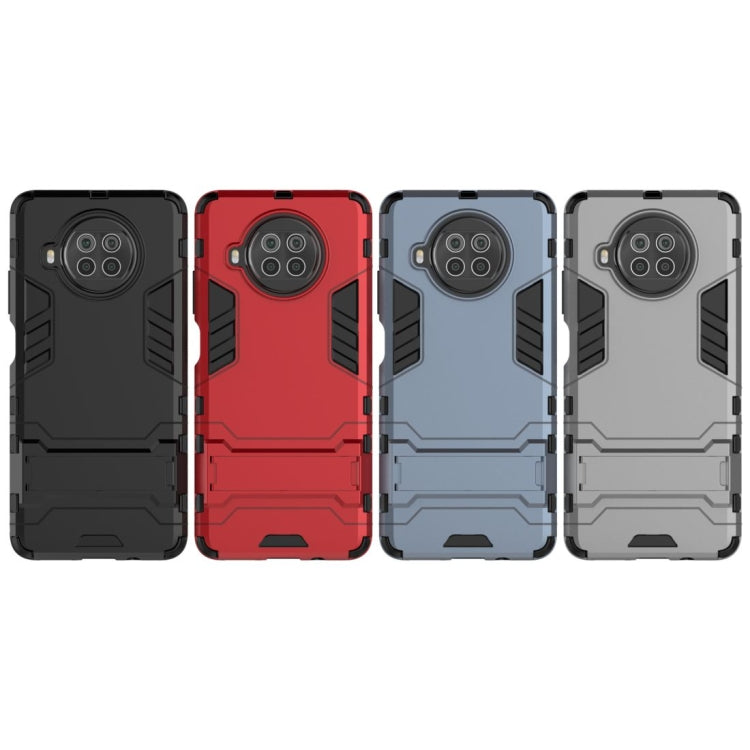 Shockproof phone case with holder, TPU-style dual-layer armor, four color options shown