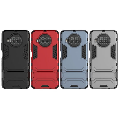 Shockproof phone case with holder, TPU-style dual-layer armor, four color options shown