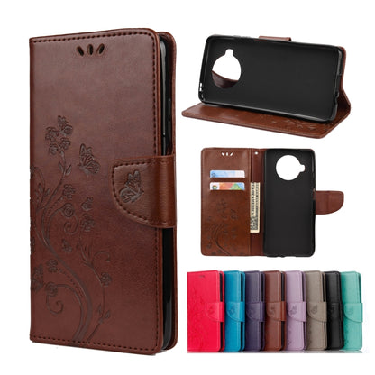Brown embossed leather flip wallet phone case with butterfly and flower pattern