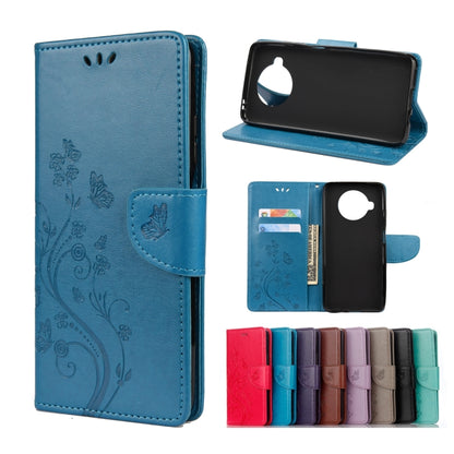Embossed butterfly-and-flower flip leather wallet case with card slots, medium blue color