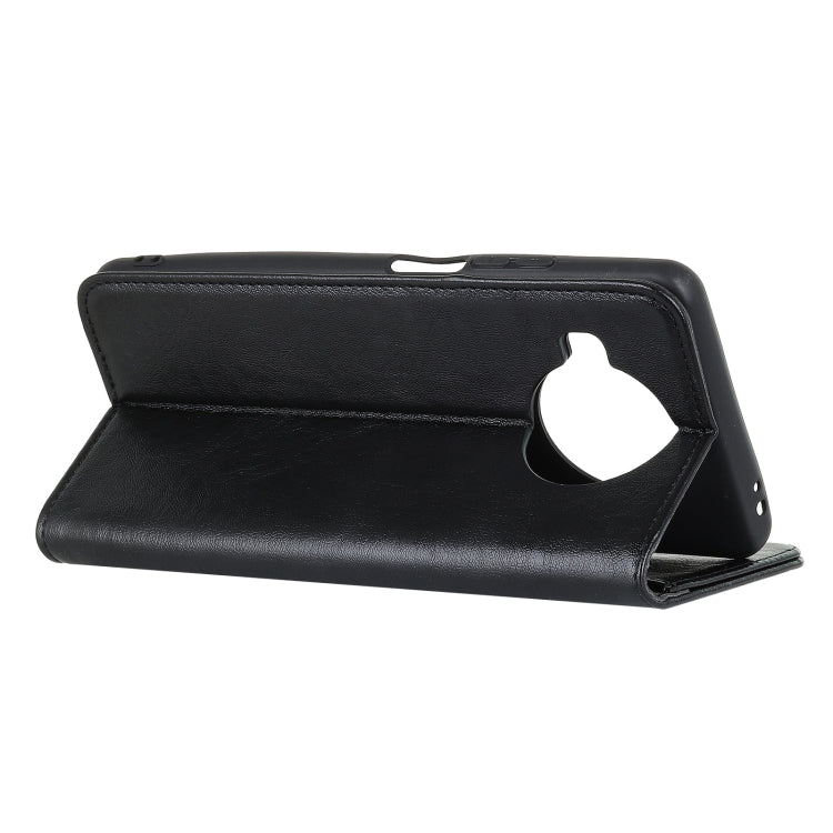 Black leather flip phone case with magnetic closure and side cutout for ports