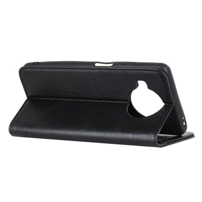 Black leather flip phone case with magnetic closure and side cutout for ports