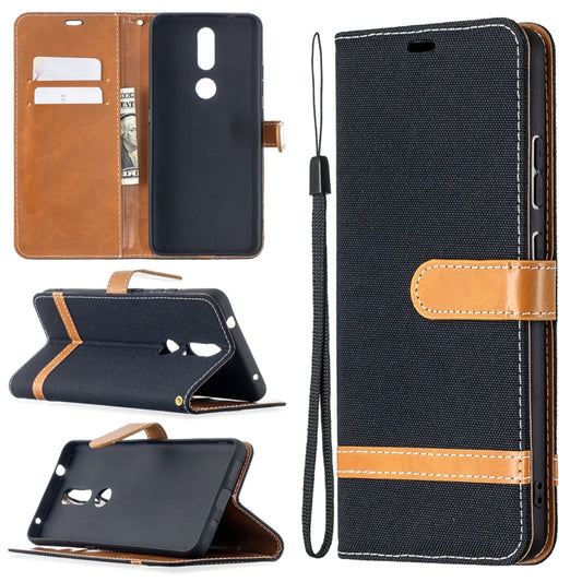 Navy denim phone wallet case showing card slots, phone cover, and lanyard