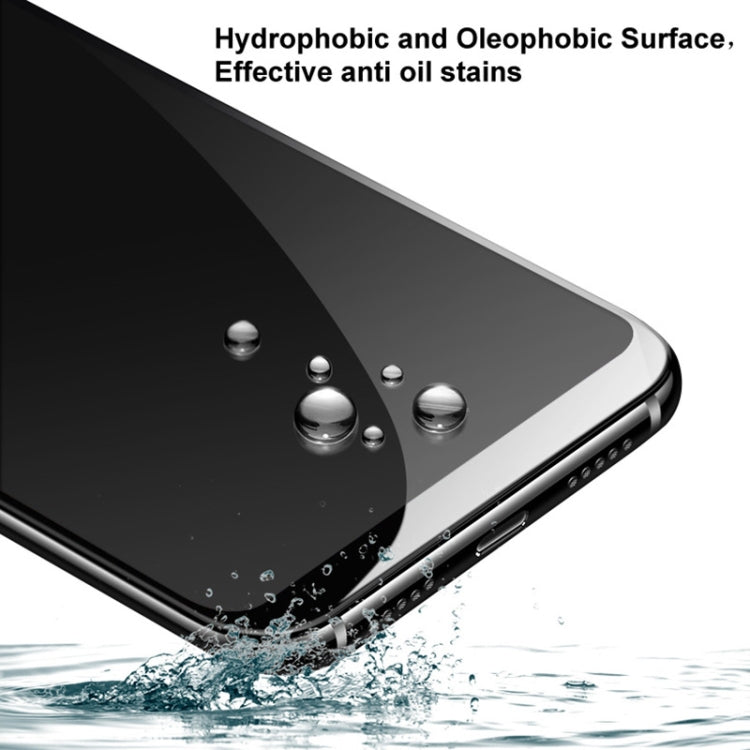 Hydrophobic tempered glass screen protector with water droplets on phone surface