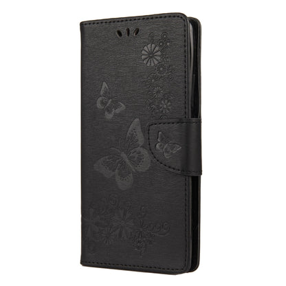 Black butterfly-embossed flip phone wallet with magnetic strap and card slots