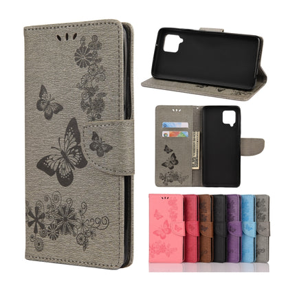 Grey butterfly-embossed flip phone wallet with card slots and camera cutout