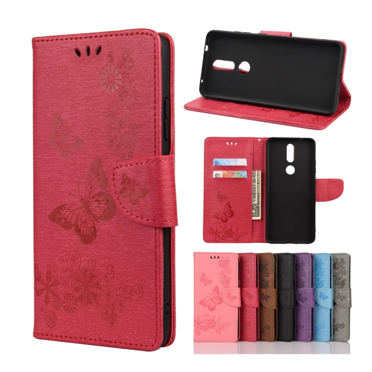 Red butterfly embossing flip leather phone case with card slots and holder