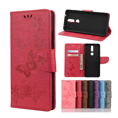Red butterfly embossing flip leather phone case with card slots and holder