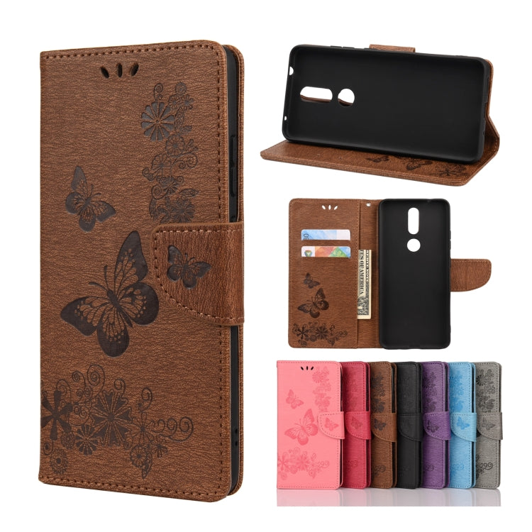 Brown butterfly embossing flip leather phone case with card slots and holder