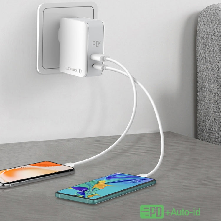 LDNIO foldable travel charger connected by cable charging a smartphone