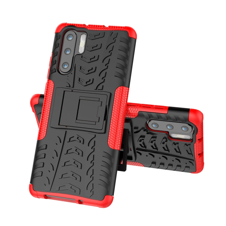 Red tire-tread shockproof phone case with holder cutout and raised camera protection