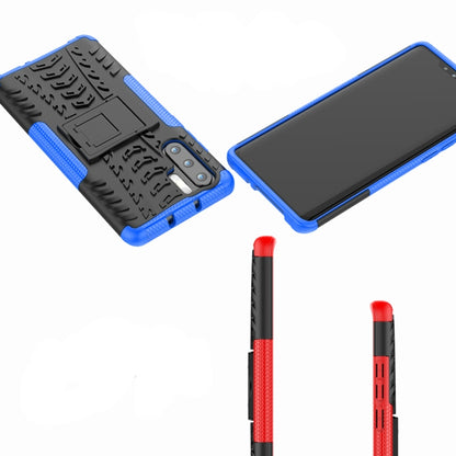 Blue and black tire-tread shockproof phone case with holder, corner protection