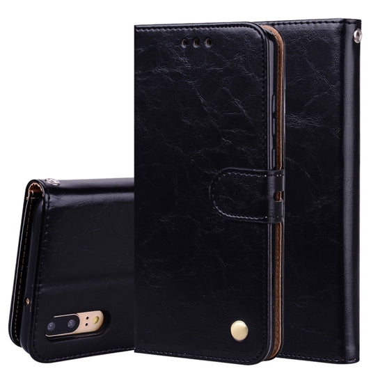 Black leather flip phone case with magnetic strap and card slots, front view.