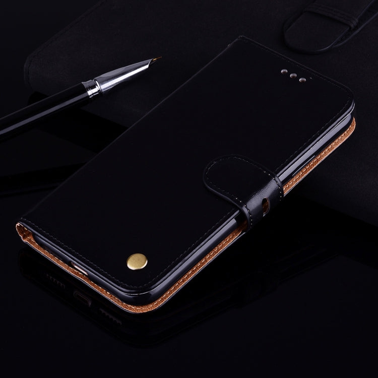 Black leather flip phone case with snap button and stitched edge detail