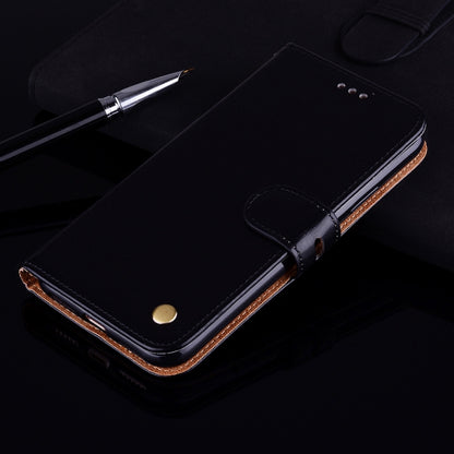 Black leather flip phone case with snap button and stitched edge detail