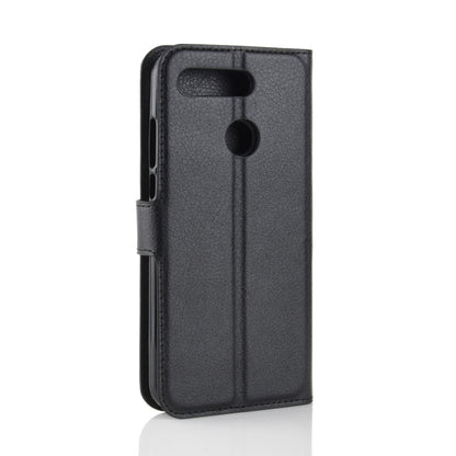Black litchi-texture leather phone case with cutouts for camera and buttons
