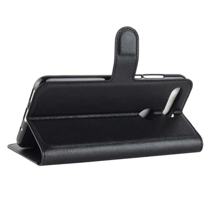 Black flip leather phone case with built-in stand for viewing