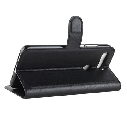 Black flip leather phone case with built-in stand for viewing