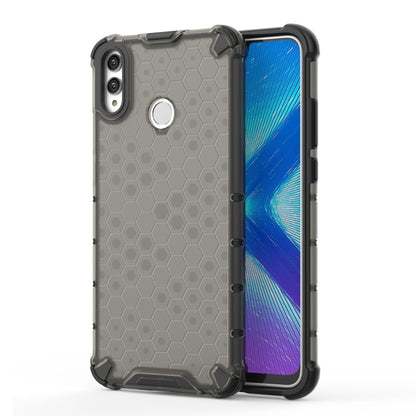 Grey honeycomb shockproof phone case with raised corners and camera cutout