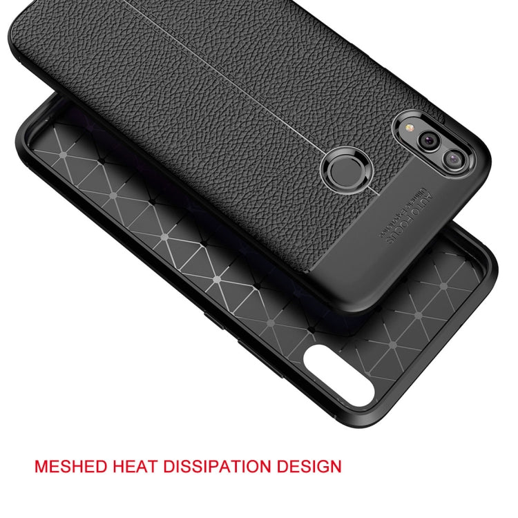 Black TPU phone case with litchi texture, raised camera protection, and side grip