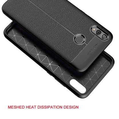 Black TPU phone case with litchi texture, raised camera protection, and side grip