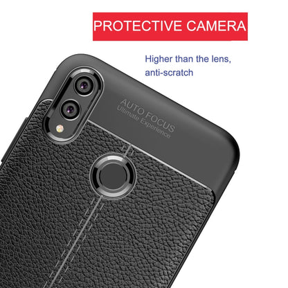 Black TPU phone case with raised camera protector and litchi-textured back