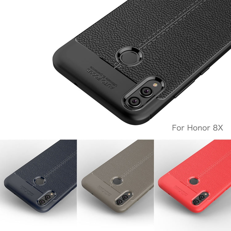 Black litchi-textured TPU phone case with circular grip and dual camera cutouts