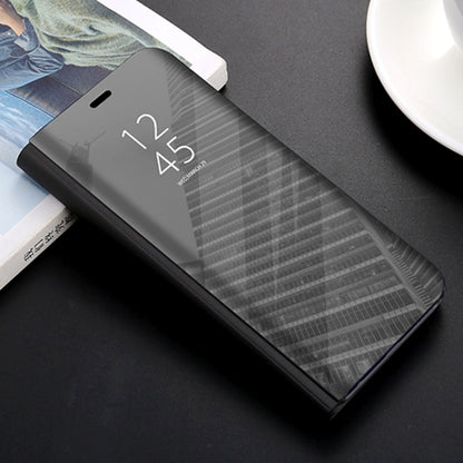 Dark gray mirror protective phone case with side port cutouts
