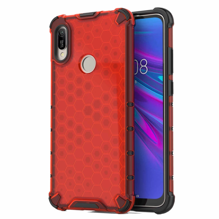 Shockproof honeycomb phone case in red with raised corners and camera cutout.
