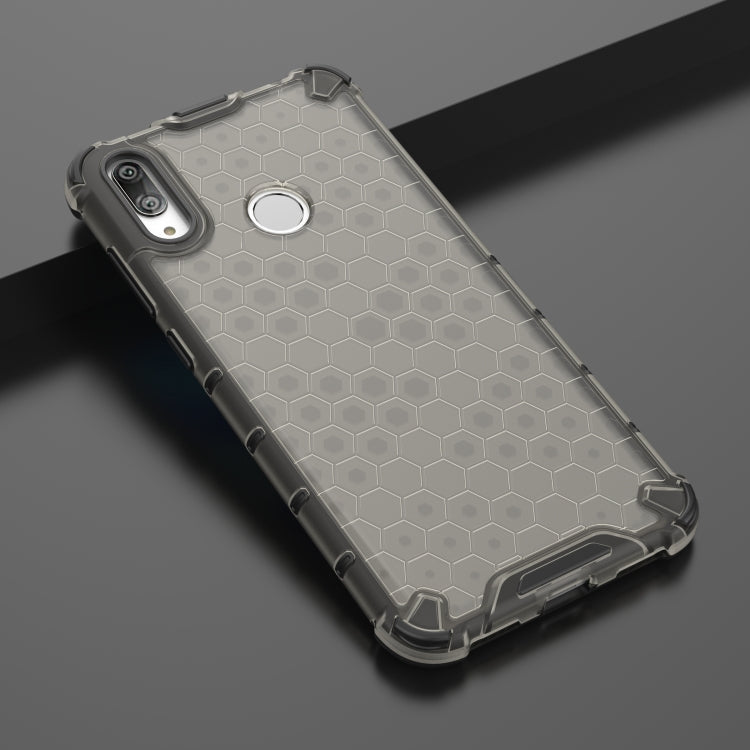Honeycomb shockproof TPU phone case, light gray hex pattern, side-angle close-up
