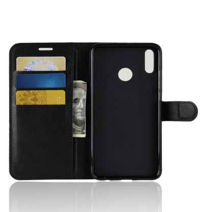 Black folio flip phone case open, showing card slots and phone back cover