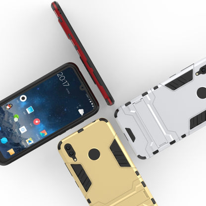 Shockproof phone cases with holder in red, white, and gold with rugged bumpers