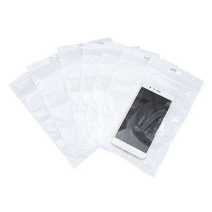 White clear-front zip jewelry bags with hang holes, shown with a phone-sized slot