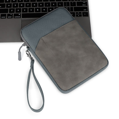 Gray tablet pouch sleeve with wrist strap, zip closure, and suede-like front panel