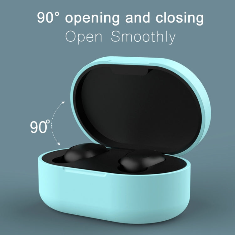 Silicone charging case cover in light blue, open with black earbuds inside