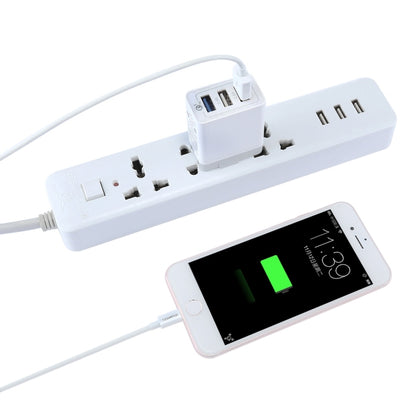 White power adapter strip with USB ports and smartphone charging cable