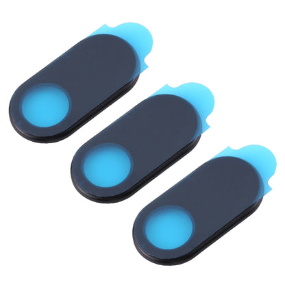 Three black oval webcam covers with blue lens openings, angled view