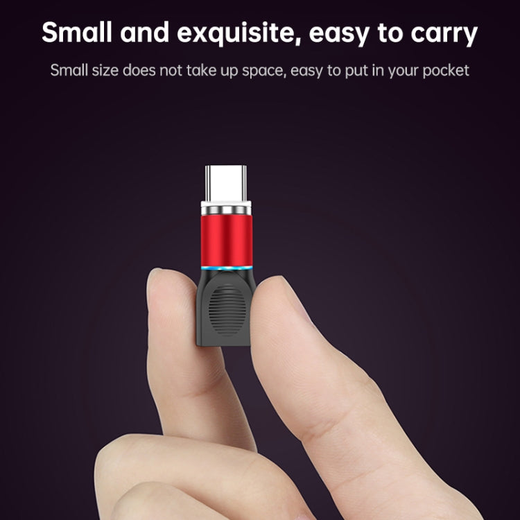Magnetic charging head with red zinc alloy body and USB-C connector, held in hand