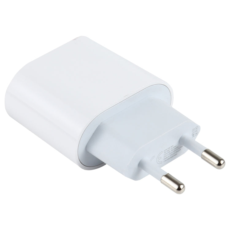 White EU plug USB-C wall charger with two metal prongs and side view of adapter