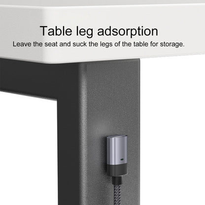 Magnetic charging head on braided cable attached to a table edge